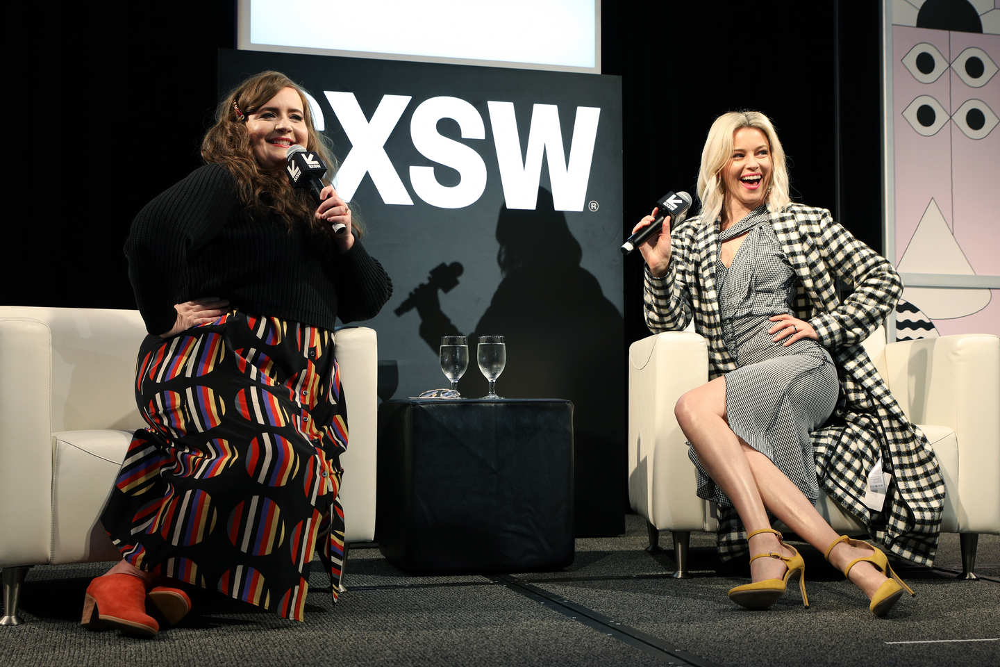 (L-R) Aidy Bryant and Elizabeth Banks speak onstage at their Featured Session: Elizabeth Banks with Aidy Bryant, talking about their new show Shrill. Photo by Mike Jordan/Getty Images for SXSW
