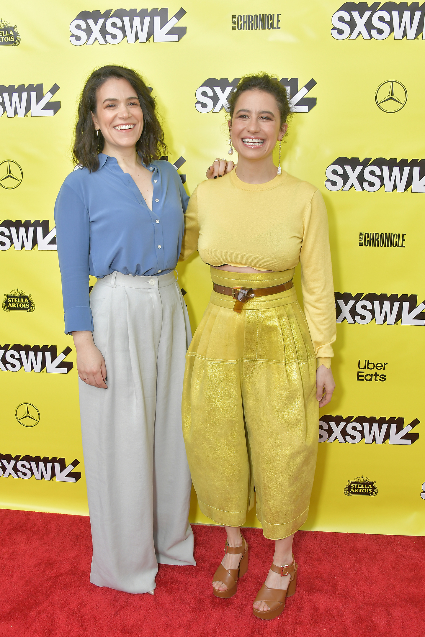 Actresses Ilana Glazer (L) and Abbi Jacobson attend the premiere of the Broad City series finale at the ZACH Theatre.