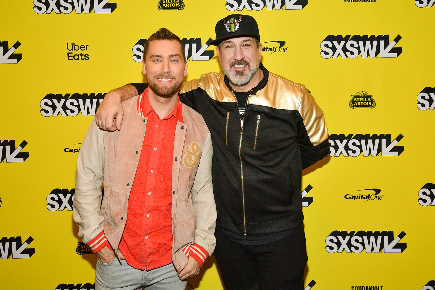 Lance Bass and Joey Fatone attend the premiere of The Boy Band Con: The Lou Pearlman Story at the Paramount Theatre.