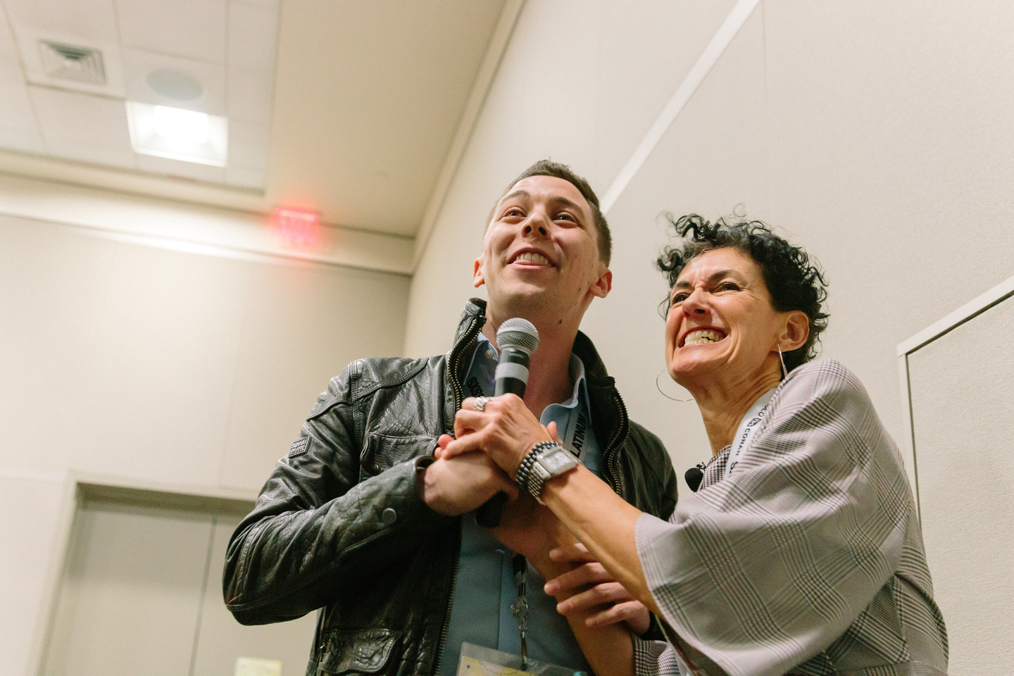 Nancy Giordano hands the mic to an audience member during the Write The Future Now! Q&A – Photo by Rey Romo